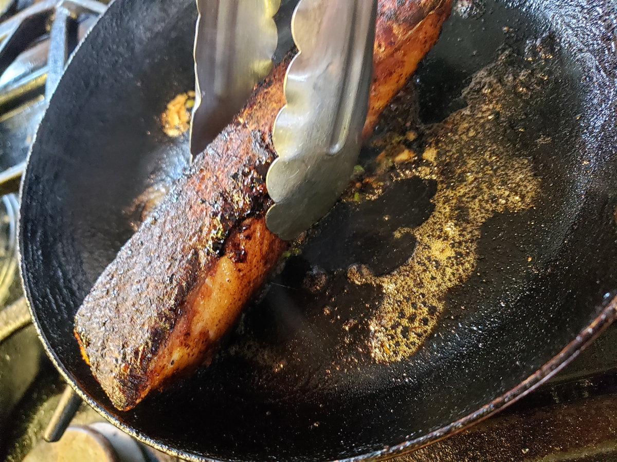 swirl salmon filet in pan to coat with glaze